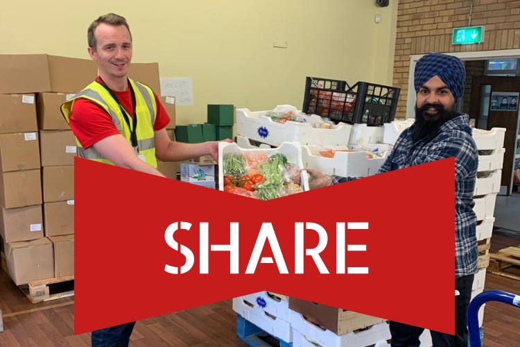 Volunteer receiving a pallet of donated surplus