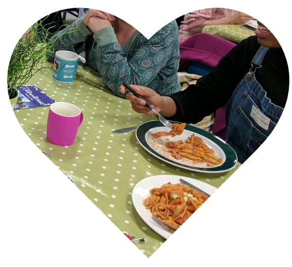 Heart showing people eating at a Pay As You Feel cafe